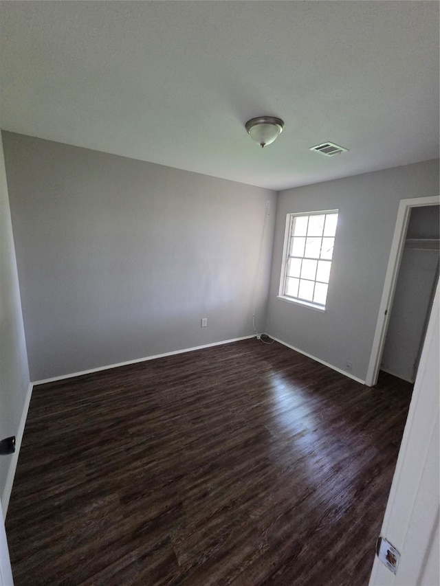 10606 Rubin St, Houston, TX 77047 - unfurnished room featuring dark wood finished floors and baseboards