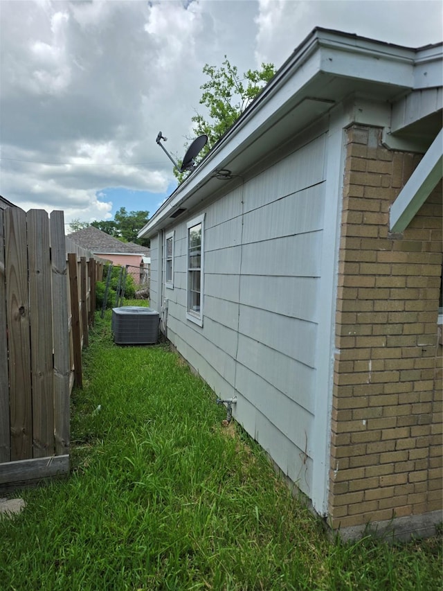 10606 Rubin St, Houston, TX 77047 - view of property exterior with a central air condition unit and brick siding