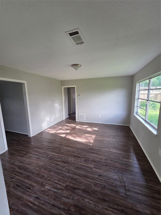10606 Rubin St, Houston, TX 77047 - spare room with dark wood-style floors and baseboards