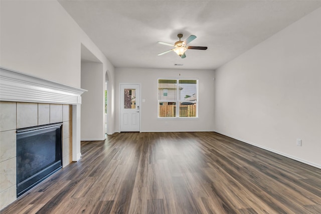 3510 Orchard Valley Ln, Spring, TX 77386 - unfurnished living room featuring a ceiling fan, dark wood-style floors, and a fireplace