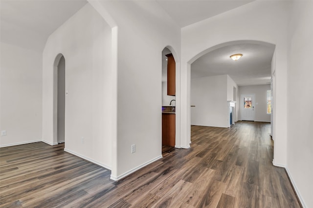 3510 Orchard Valley Ln, Spring, TX 77386 - spare room featuring dark wood finished floors and arched walkways