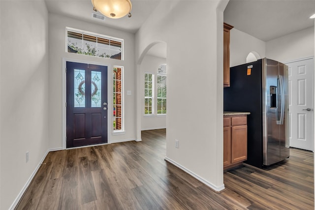3510 Orchard Valley Ln, Spring, TX 77386 - foyer featuring dark wood-style flooring and arched walkways