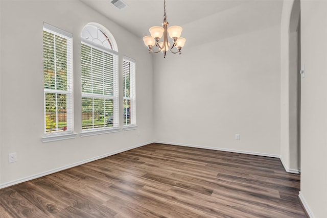3510 Orchard Valley Ln, Spring, TX 77386 - empty room with dark wood-style floors, a chandelier, and arched walkways