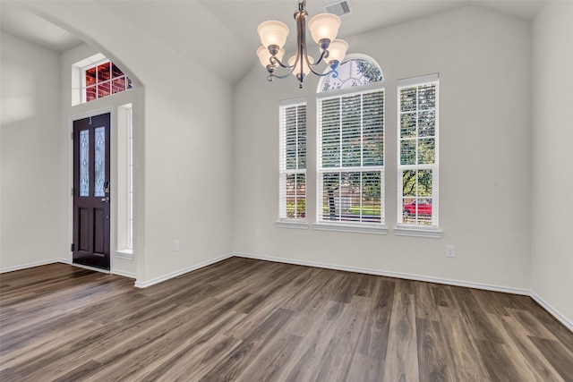 3510 Orchard Valley Ln, Spring, TX 77386 - foyer entrance with plenty of natural light, a chandelier, wood finished floors, lofted ceiling, and arched walkways