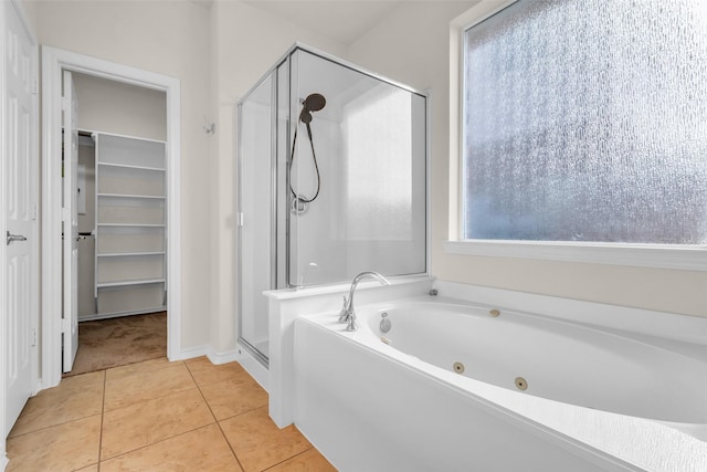 3510 Orchard Valley Ln, Spring, TX 77386 - full bathroom with a stall shower, a tub with jets, tile patterned floors, and a spacious closet