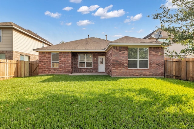 3510 Orchard Valley Ln, Spring, TX 77386 - back of house featuring a fenced backyard, brick siding, roof with shingles, and a patio area