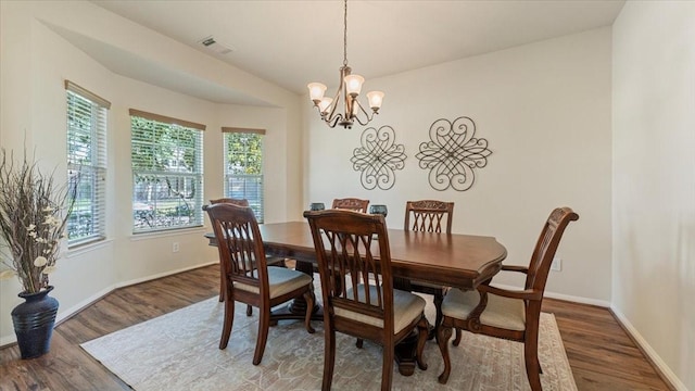 14822 Meridian Park Ln, Humble, TX 77396 - dining room featuring wood finished floors and a chandelier