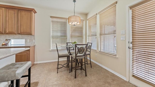 14822 Meridian Park Ln, Humble, TX 77396 - dining room with light tile patterned flooring and baseboards