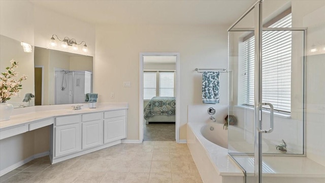 14822 Meridian Park Ln, Humble, TX 77396 - full bath featuring vanity, a garden tub, a stall shower, ensuite bathroom, and tile patterned floors