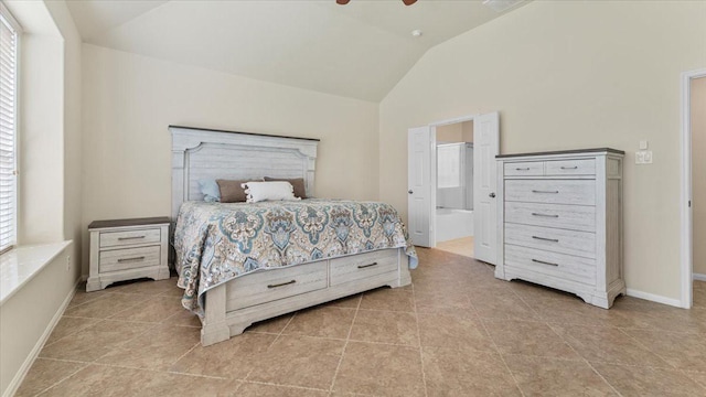 14822 Meridian Park Ln, Humble, TX 77396 - tiled bedroom featuring vaulted ceiling, a ceiling fan, and connected bathroom