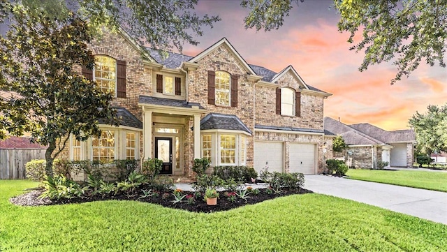 14822 Meridian Park Ln, Humble, TX 77396 - view of front of home with driveway, an attached garage, and brick siding
