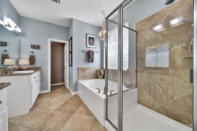 17003 Buffalo Peak Ct, Humble, TX 77346 - full bathroom with vanity, a shower stall, and a garden tub
