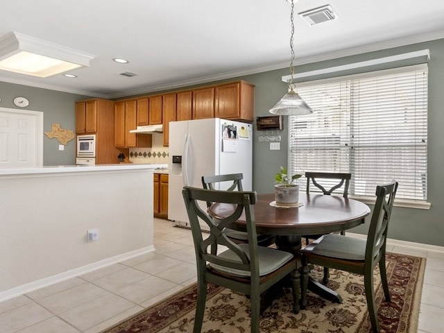 10415 Claybrook Dr, Houston, TX 77089 - dining space with crown molding and light tile patterned floors