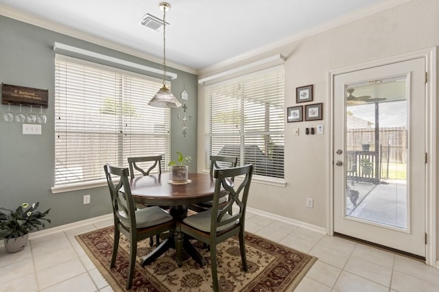 10415 Claybrook Dr, Houston, TX 77089 - dining area with crown molding, plenty of natural light, and light tile patterned flooring