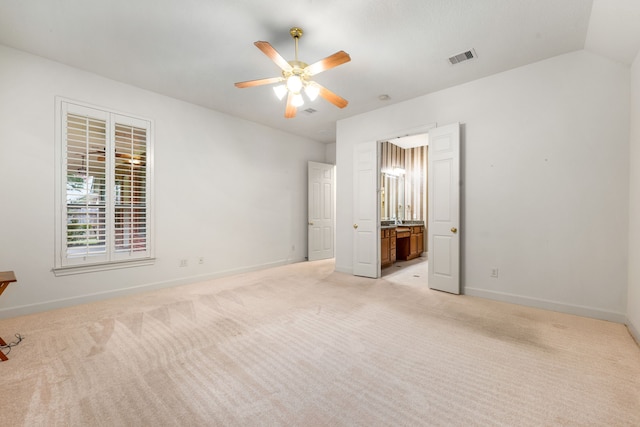 21510 Briar Landing Ln, Katy, TX 77450 - unfurnished bedroom featuring light carpet, ensuite bathroom, lofted ceiling, and ceiling fan