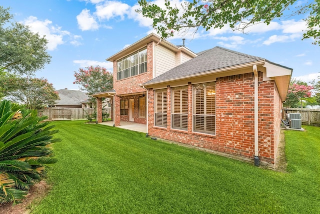 21510 Briar Landing Ln, Katy, TX 77450 - back of property featuring a patio, brick siding, and a shingled roof