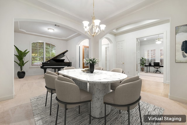 21510 Briar Landing Ln, Katy, TX 77450 - dining space featuring arched walkways, light colored carpet, a chandelier, a raised ceiling, and crown molding