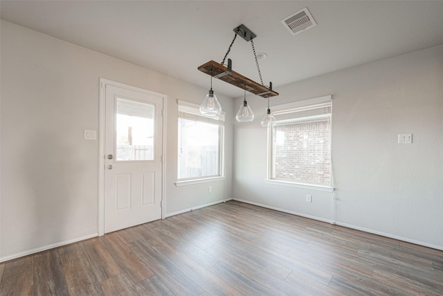 3022 Darlington Ct, Katy, TX 77494 - unfurnished dining area with wood finished floors and baseboards