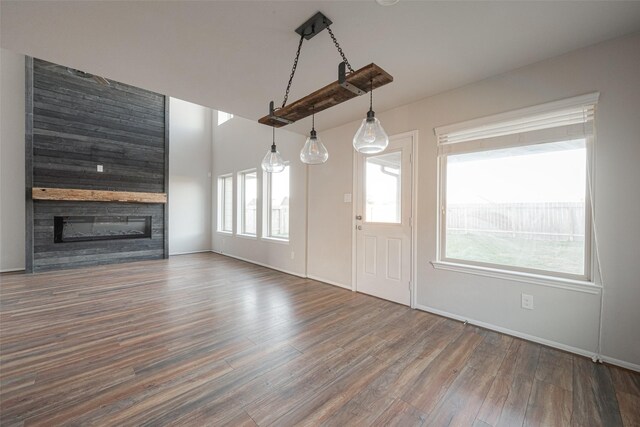 3022 Darlington Ct, Katy, TX 77494 - unfurnished living room with wood finished floors and a glass covered fireplace
