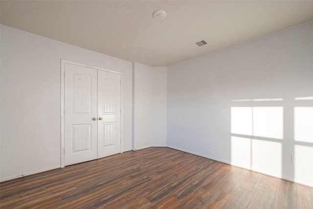 3022 Darlington Ct, Katy, TX 77494 - unfurnished bedroom with wood finished floors and a closet