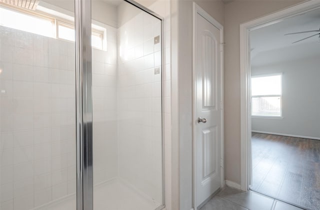 3022 Darlington Ct, Katy, TX 77494 - full bath featuring a stall shower, a ceiling fan, and tile patterned flooring