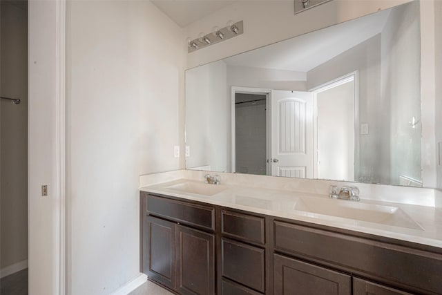 3022 Darlington Ct, Katy, TX 77494 - bathroom featuring double vanity and baseboards
