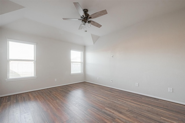 3022 Darlington Ct, Katy, TX 77494 - spare room featuring dark wood-style floors, vaulted ceiling, and a ceiling fan