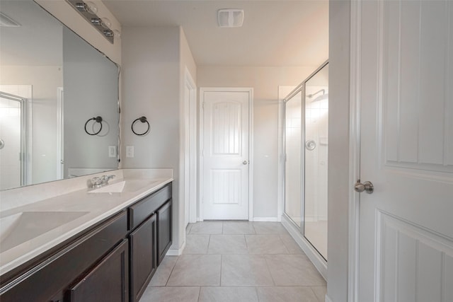 3022 Darlington Ct, Katy, TX 77494 - bathroom featuring a shower stall, double vanity, and tile patterned floors