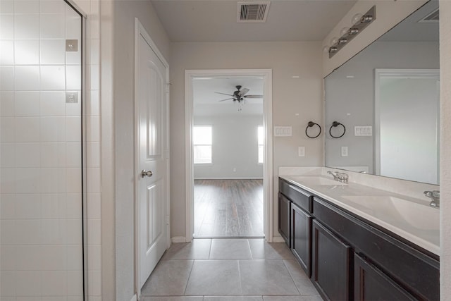 3022 Darlington Ct, Katy, TX 77494 - full bathroom featuring ceiling fan, double vanity, tile patterned flooring, and a tile shower