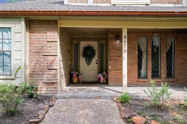 8519 Rebawood Dr, Humble, TX 77346 - doorway to property with brick siding and a shingled roof