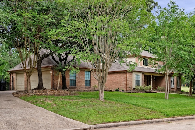 8519 Rebawood Dr, Humble, TX 77346 - view of front facade featuring brick siding, a front lawn, and driveway