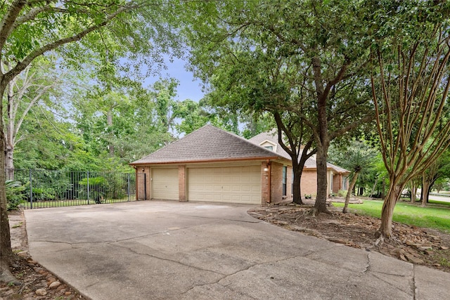 8519 Rebawood Dr, Humble, TX 77346 - view of front of house featuring brick siding, driveway, and a shingled roof