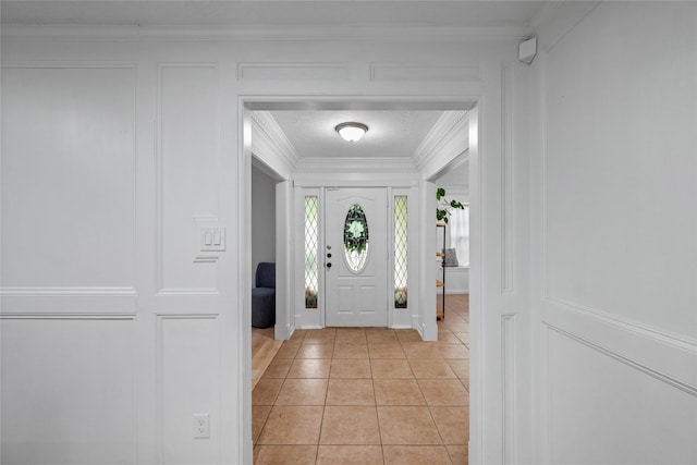 8519 Rebawood Dr, Humble, TX 77346 - foyer featuring crown molding, a decorative wall, and light tile patterned floors
