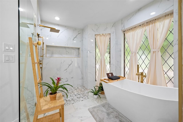 8519 Rebawood Dr, Humble, TX 77346 - full bath with marble tiled floors, a marble finish shower, a freestanding bath, and recessed lighting