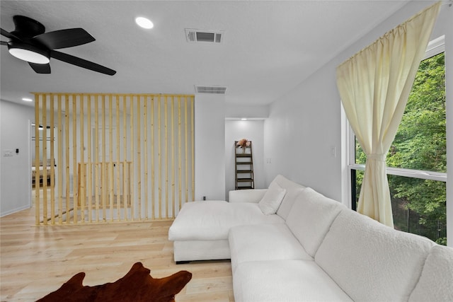 8519 Rebawood Dr, Humble, TX 77346 - living area featuring wood finished floors, a ceiling fan, and recessed lighting
