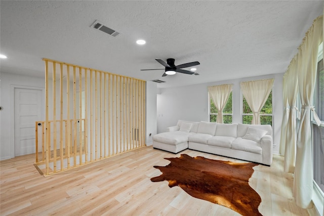 8519 Rebawood Dr, Humble, TX 77346 - living area with recessed lighting, a textured ceiling, wood finished floors, and ceiling fan