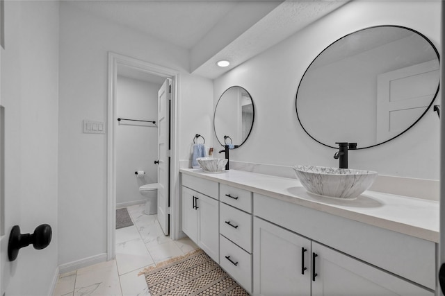 8519 Rebawood Dr, Humble, TX 77346 - full bath with marble look tiles, double vanity, and recessed lighting
