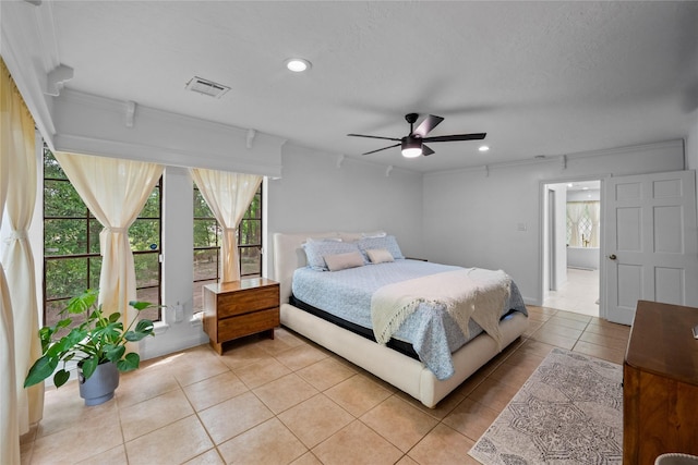 8519 Rebawood Dr, Humble, TX 77346 - bedroom with multiple windows, light tile patterned floors, ornamental molding, recessed lighting, and ceiling fan