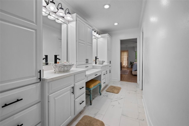 8519 Rebawood Dr, Humble, TX 77346 - ensuite bathroom with double vanity, recessed lighting, marble look tiles, and crown molding