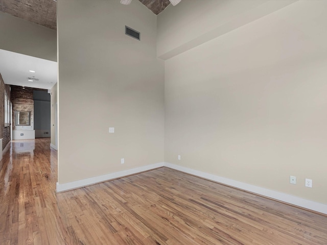 2700 Albany St Unit 3A, Houston, TX 77006 - unfurnished room with light wood-type flooring and a towering ceiling