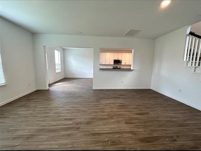 1009 Laguna Cove Dr, Katy, TX 77493 - unfurnished living room with dark wood-type flooring
