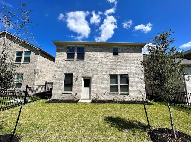 1009 Laguna Cove Dr, Katy, TX 77493 - back of house with a fenced backyard and brick siding