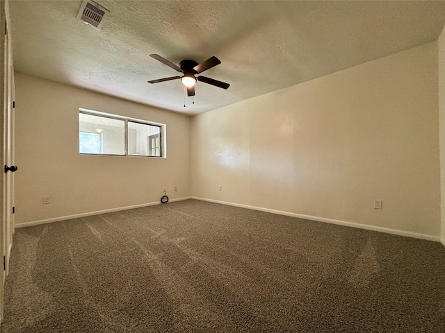609 S Gray Ave, West Columbia, TX 77486 - unfurnished room featuring a ceiling fan, a textured ceiling, and dark carpet