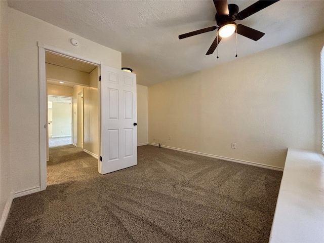 609 S Gray Ave, West Columbia, TX 77486 - carpeted empty room with a smoke detector and a ceiling fan