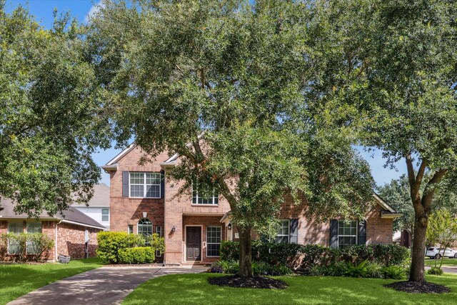 1402 Sullivan Springs Dr, Katy, TX 77494 - view of front facade featuring brick siding and a front lawn