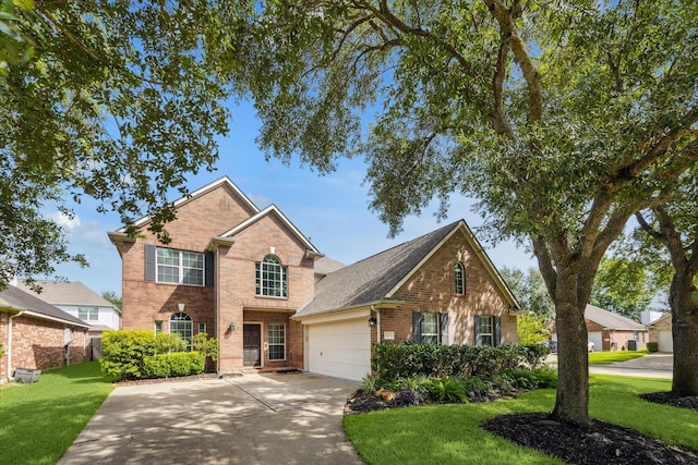1402 Sullivan Springs Dr, Katy, TX 77494 - traditional home with brick siding, a front yard, an attached garage, and driveway