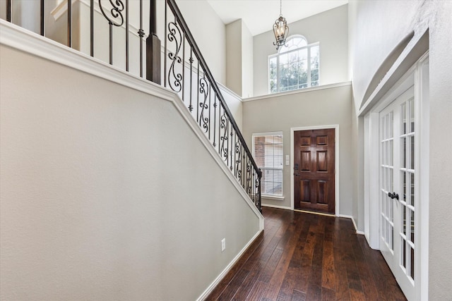 1402 Sullivan Springs Dr, Katy, TX 77494 - entryway with a chandelier, stairs, hardwood / wood-style flooring, a high ceiling, and french doors