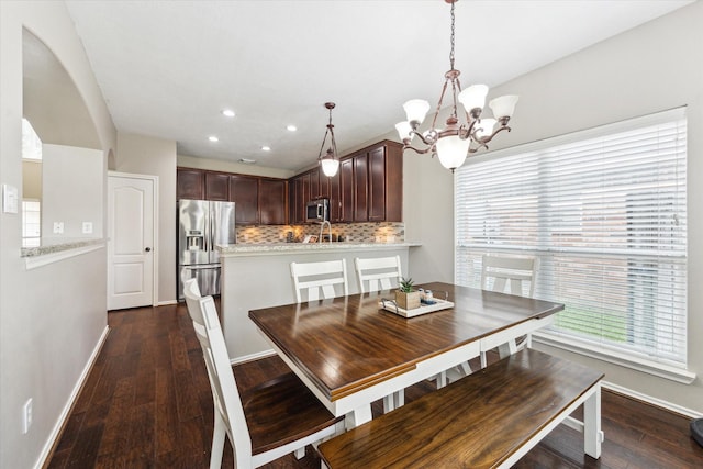 1402 Sullivan Springs Dr, Katy, TX 77494 - dining area featuring a chandelier, plenty of natural light, dark wood-style flooring, and recessed lighting