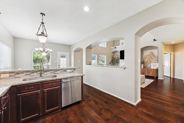 1402 Sullivan Springs Dr, Katy, TX 77494 - kitchen with stainless steel dishwasher, dark wood-type flooring, light stone countertops, healthy amount of natural light, and recessed lighting