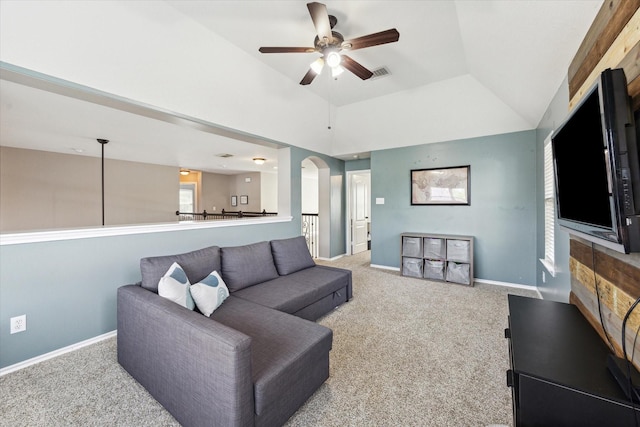 1402 Sullivan Springs Dr, Katy, TX 77494 - carpeted living area with ceiling fan, arched walkways, and lofted ceiling
